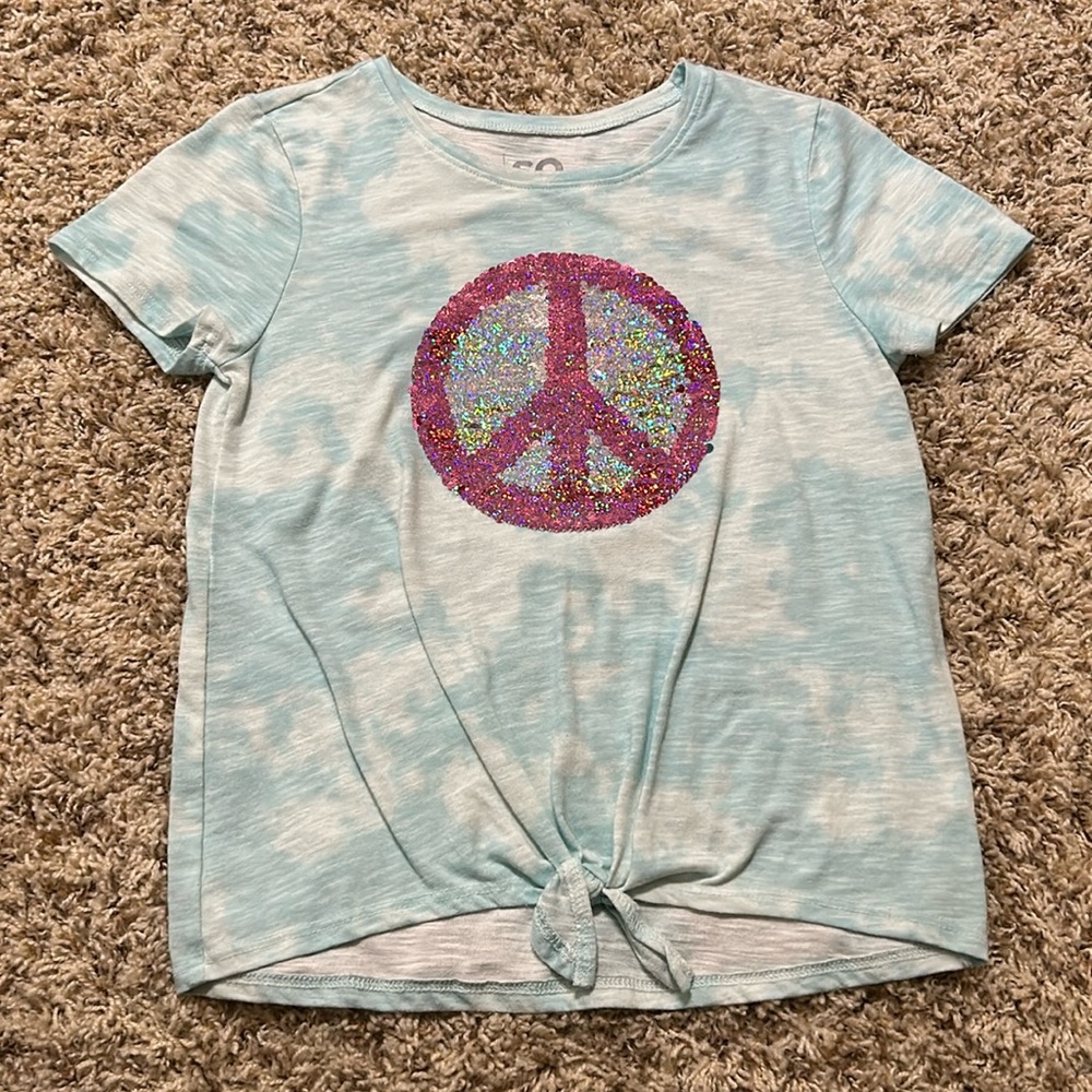 Blue t shirt with flip sequin peace sign